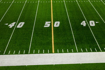 Wall Mural - Football 50 Yard Line with yellow stripe and green artificial turf