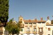 old and small colorful Spanish town houses and town hall with balconies