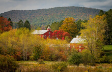 Historic Red Barn And Farm Buildings Nestled In The Trees In Autumn Near Aurora In West Virginia In The Fall