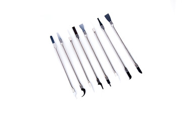 Silver computer repair tool kit with mutliple tips for lifting components top down view