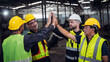 © NewSaetiew - Team engineers and foreman stack hand and shake hands to show success at factory machines. Mechanical Team Operating Machinery.