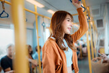 Fototapeta  - Happy young Asian woman passenger taking the subway train station, lifestyle, transportation.	