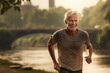 Healthy senior man jogging at the riverside