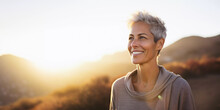 Lifestyle Portrait Of Happy Mature Woman Walking Alone On Park Trail Outside