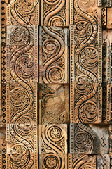 Wall decorative patterns of Qutb complex in South Delhi, India, close up ancient bas relief