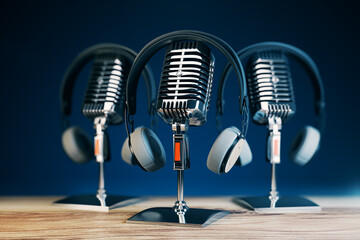 Poster - Close up of three steel vintage singing vocal microphones on wooden surface and blue background. 3D Rendering.