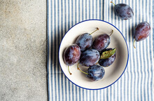 Ripe Plums In Bowl