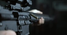 Shooting With Assault Rifle In Super Slow-motion 800 Fps, Bullet Flying In The Air From Chamber, Detail Close-up GUN Firing In High-speed, Multiple Shots