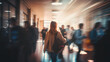 A blurry image capturing high school students navigating crowded hallways between classes in a bustling school building