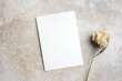 Blank wedding or invitation card mockup with dry flower, trendy vintage style card