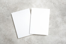 Two Paper Invitation Cards On Trendy Grey Background With Copy Space For Card Design Presentation
