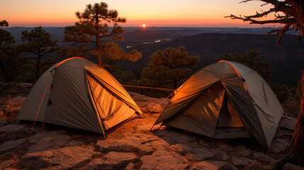 Wall Mural - Camping scene with tents placed amidst wilderness during sunset.
