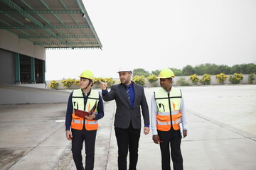 Wall Mural - worker or engineer working in factory with safety uniform , safety hat and safety glasses , image is safety concept or happy workplace