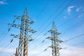 power line support with wires for electricity transmission. High voltage grid tower with wire cable at distribution station. Energy industry.