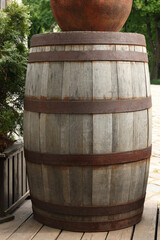 Canvas Print - Traditional wooden barrel on street outdoors. Wine making