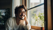 © Hanako ITO - 明るい窓辺で微笑む30代の日本人男性のポートレート