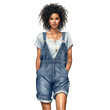 African american woman wearing bib overalls and a t-shirt. Hands in pockets