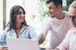 © BullRun - Business partners using gadgets in work and talking to each other
