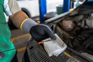 Close up view of a Maintenance Car service - auto oil change, motor check, brake cleaning, tire check, engine inspection, motor oil-brake inspection