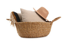 Wicker Basket With Cushions And Hat Isolated On White Background