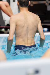 Wall Mural - Boy Doing Water Aerobics Outdoor in a Swimming Pool