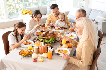 Poster - Happy family having dinner at festive table on Thanksgiving Day