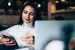 © BullRun - Serious female paying for service online