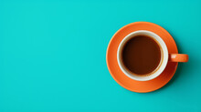 Beautiful Cyan Coffee Cup Over Orange Background