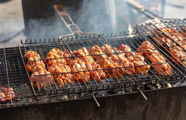 Wall Mural - The meat is fried on the grill over the coals of the grill