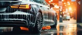 Fototapeta  - Car wash in car wash. Car wash concept. Car with foam and soap