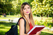 © Minerva Studio - Beautiful female student holding a book outdoor