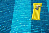 Fototapeta Przestrzenne - Beach summer holiday background. Inflatable air mattress, flip flops and hat on swimming pool.