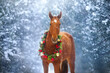 Horse in winter snow in christmas decoration