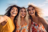 Fototapeta Młodzieżowe - Cheerful girls friends taking selfie at beach. Summer holiday vacation.