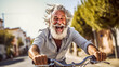 Laughing gray-haired senior on bicycle on street