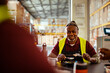 © Marko Geber - Senior worker having lunch on a break while working in a warehouse