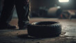 Mechanic repairing dirty tire on old car in dark workshop generated by AI