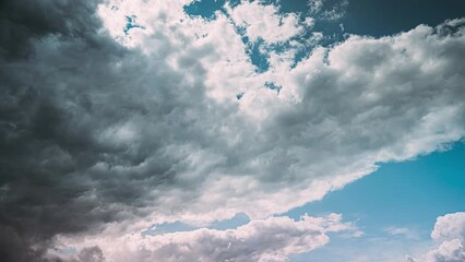 Wall Mural - Timelapse Dark Blue Cloudy Rainy Sky. Rain Heavy Clouds Give Way To White Fluffy Clouds. Sky Natural Background. Cumulonimbus Cloud. Weather Forecast Concept. Enlightenment Concept. From Dark To Light