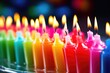 group of colorful birthday candles in holders