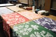 patterns printed on fabric, spreading on a table