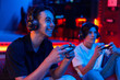© frimufilms - Two teen friends are playing a game console