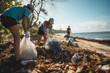 Young people cleaning the beach of waste and plastic