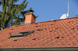 the roof of a family house with red tiles, red bags on the roof of the house ready for photovoltaic installations, installation of photovoltaic panels