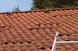 the roof of a family house with red tiles, red bags on the roof of the house ready for photovoltaic installations, installation of photovoltaic panels,