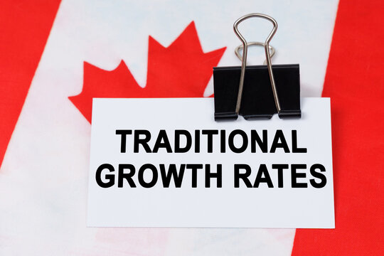 On the flag of Canada lies a business card with the inscription - traditional growth rates