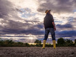 © Ancoay - Image of a farmer looking at the sky worried about the lack of rain and water. Climate crisis and drought