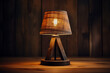 Rustic wooden table lamp radiating ambient light isolated on a gradient background 