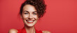 Smiling beautiful woman on solid red background
