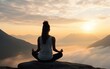 © piai - Woman sitting yoga pose on a rock at sunrise in the morning