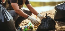 Dedicated Volunteer Cleans River Park, Diligently Picking Up Plastic Garbage For A Cleaner Environment